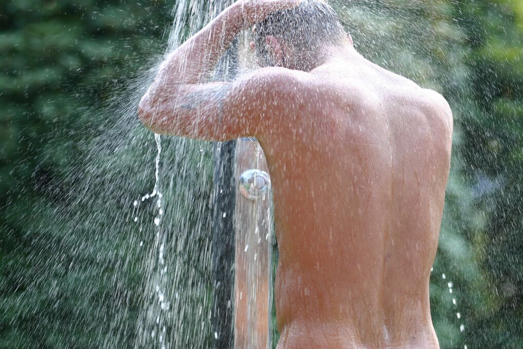 After a bath with soda, a man needs to take a cool shower. 
